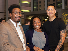 Three new Discovery Fellows pose for a photo at fall reception