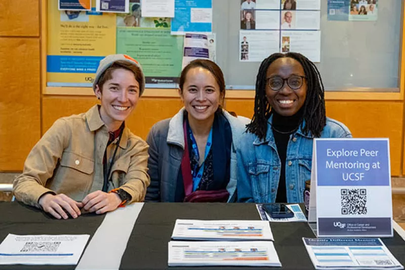 Ray Care, Linda Louie, and Jocelyne Fadiga staff OCPD's resource table