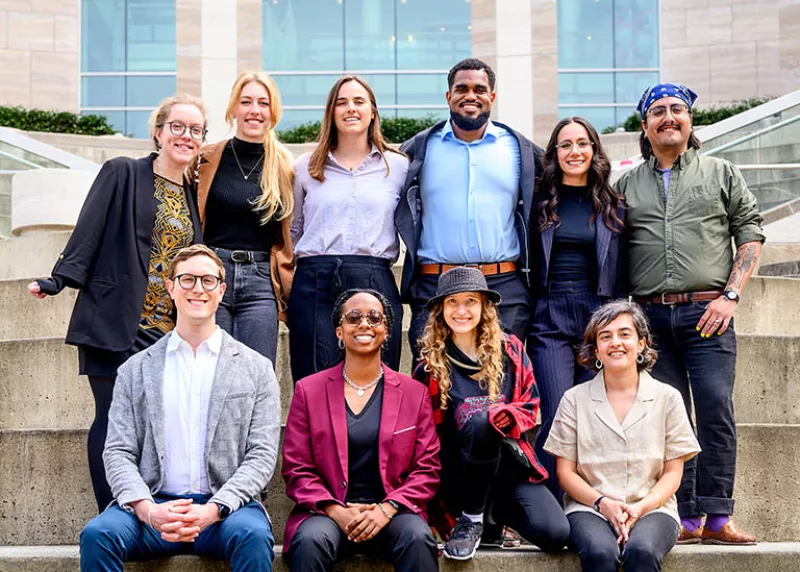 Ten Grad Slam finalists gather on the steps of Genentech Hall before the competition on April 3, 2024