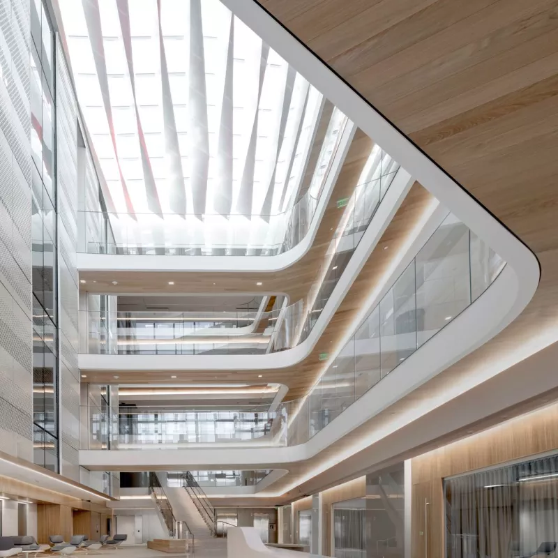 Light filled builing atrium with balconies and stairs