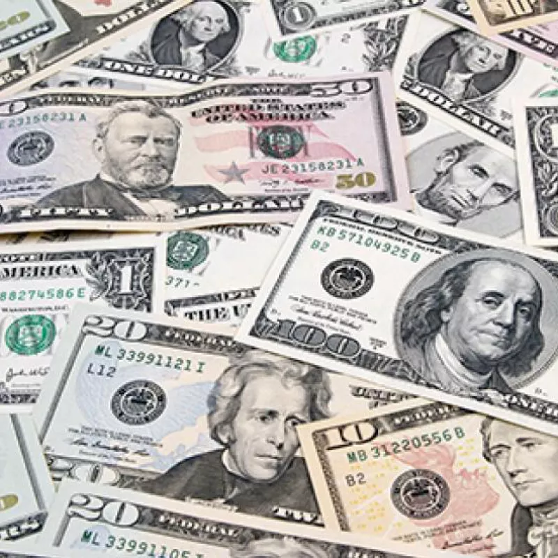 10, 20, 50 and 100 dollar bills spread out
