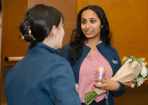 Nilla Sivakumar chats with a fellow PhD candidate