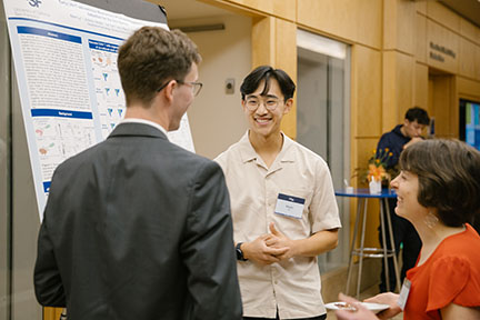 Kevin Ly presents his poster