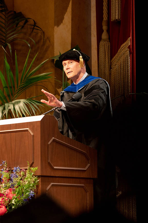 Charles Craik, PhD gestures to make a point during his commencement address