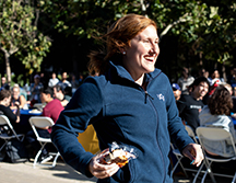 A student runs up to claim her raffle prize