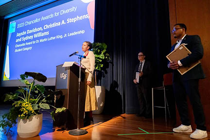 Christina Stephens speaks at podium upon accepting the 2023 Chancellor Award for Dr. Martin Luther King, Jr. Leadership on October 24