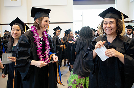 PhD grads from the Tetrad program enjoy a laugh before the June 5 ceremony.